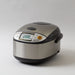 Rice cooker with digital display on a light gray background