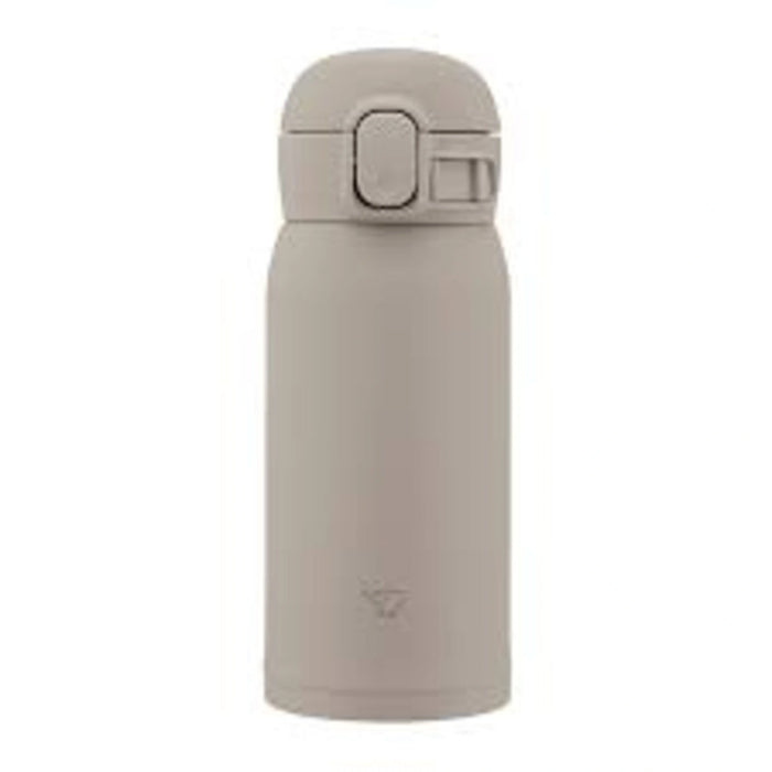 Beige water bottle with a cap on a white background