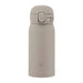 Beige water bottle with a cap on a white background