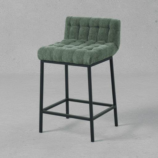 Green bar stool with tufted seat on a gray background