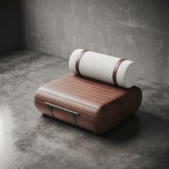 Modern chair with a cylindrical cushion against a concrete wall.