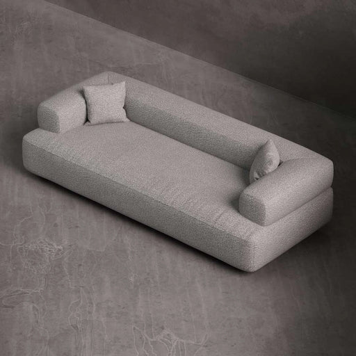 Gray sofa with cushions on a dark gray background