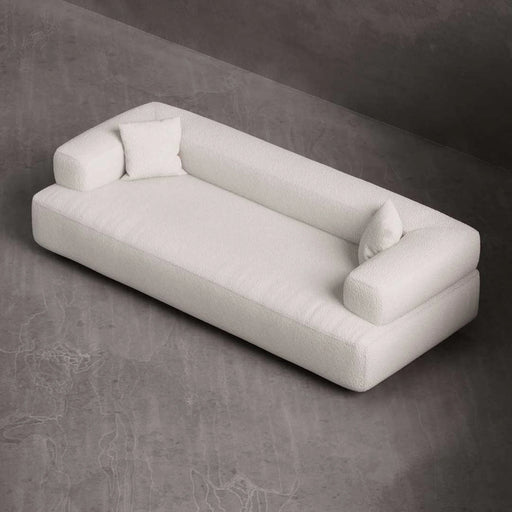White sofa on a gray textured surface