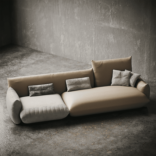Beige sofa with cushions in a minimalistic room with concrete walls and floor.
