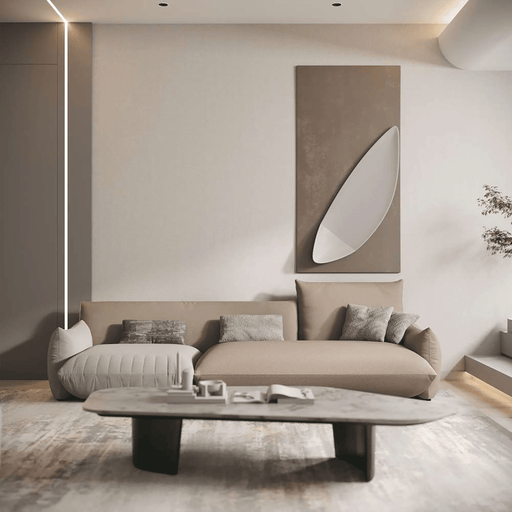 Modern living room with a beige sofa, coffee table, and abstract wall art.