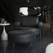 Black leather armchair with cowhide pattern backrest in a dimly lit room.