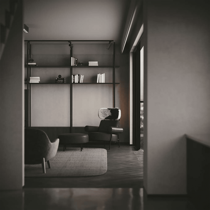 Modern interior with dark furniture and shelves in a dimly lit room.