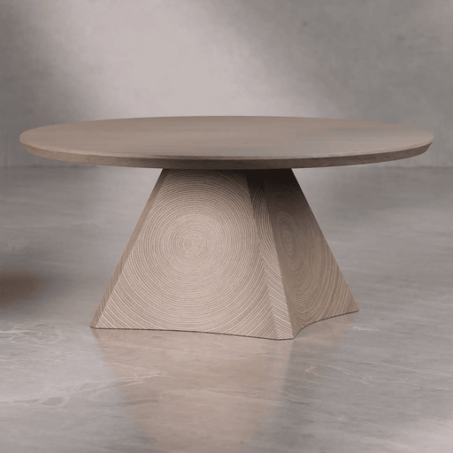 Round wooden table with a unique base design on a gray background