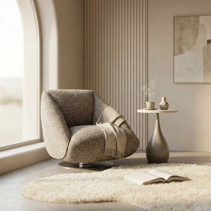Modern armchair in a stylish room with a side table and abstract art.