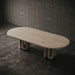 Wooden table with unique base design on a dark concrete floor and wall.