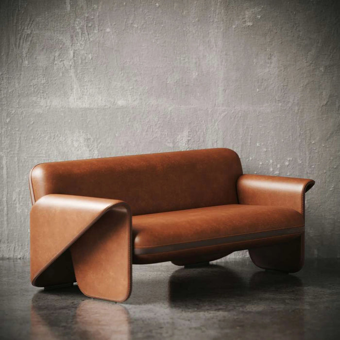 Brown leather sofa against a textured gray wall
