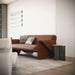 Modern living room with a brown sofa and decorative pillows.