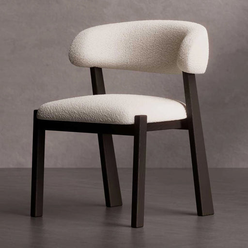 Chair with white textured cushioned seat and backrest on a gray background