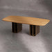 Wooden table with unique base design on a gray concrete floor