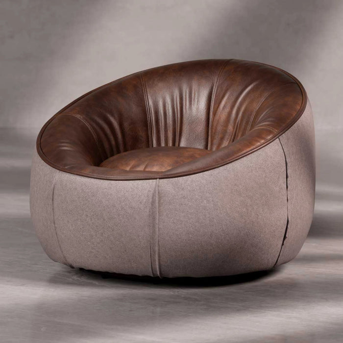 Modern chair with brown leather and gray fabric on a neutral background