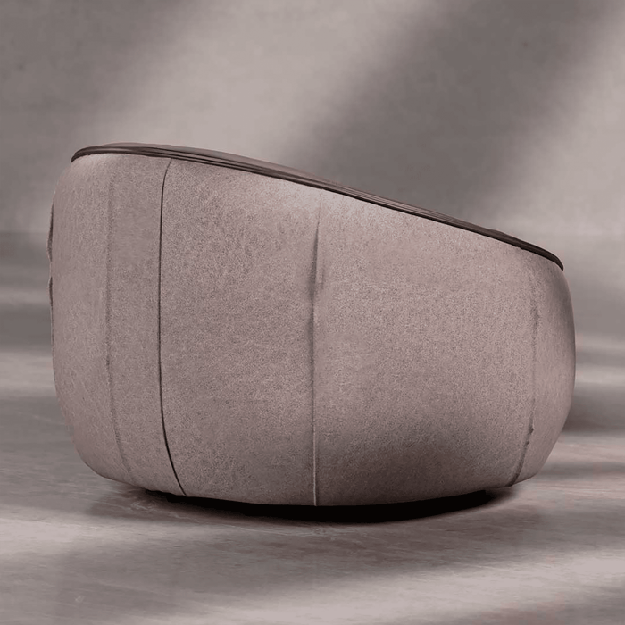 Gray fabric ottoman on a gray background