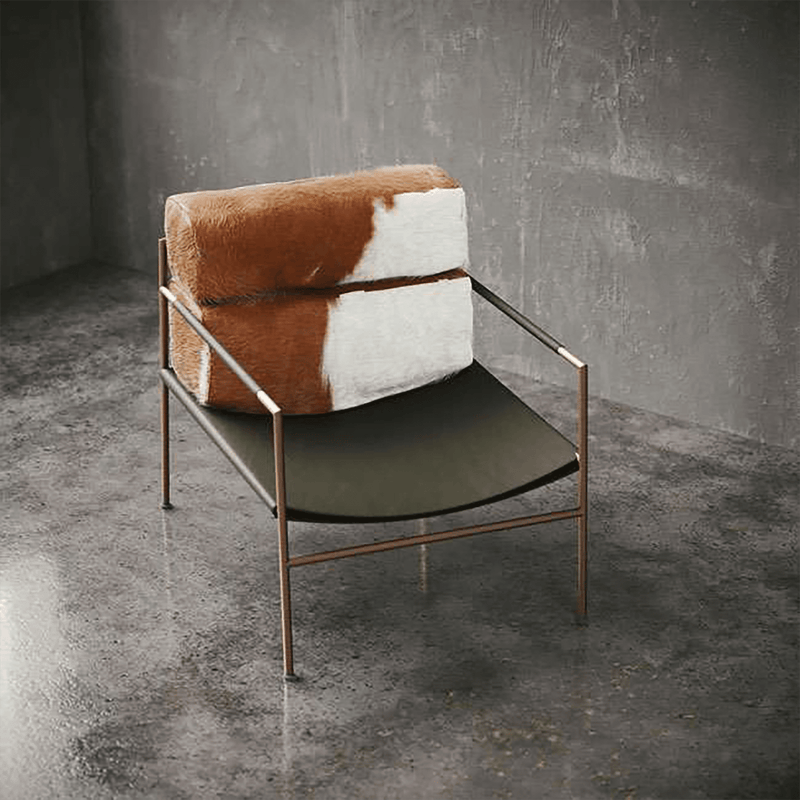 Chair with cowhide backrest and green seat in a minimalistic setting