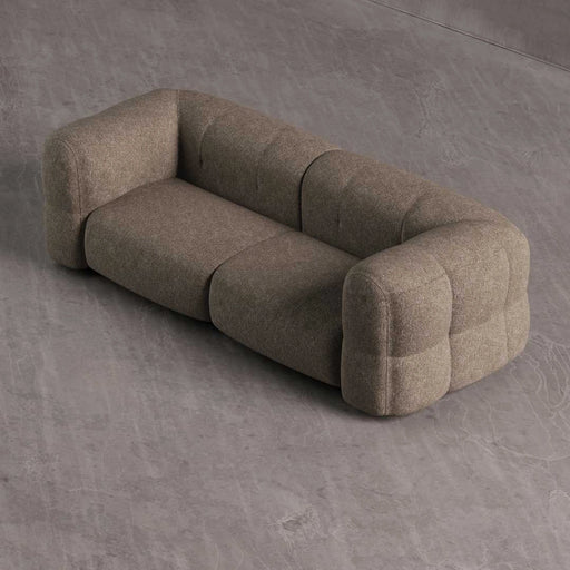 Brown sofa on a gray concrete floor