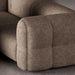 Close-up of a textured brown sofa corner