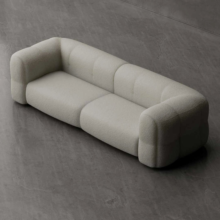 Beige sofa on a gray concrete floor