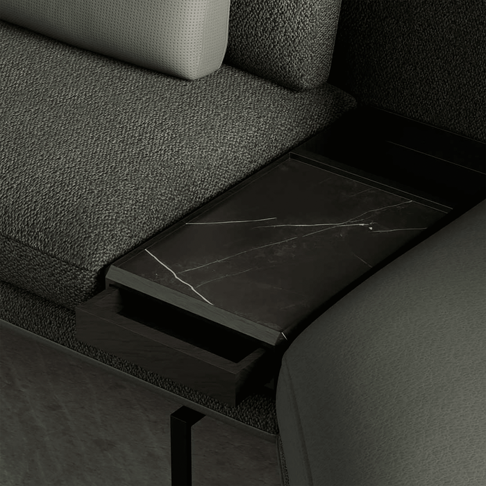 Dark gray sofa with a marble-patterned tray on a dark background