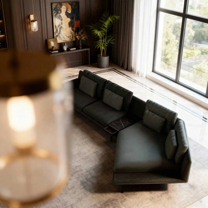 Modern living room with a gray sectional sofa, large window, and decorative elements.