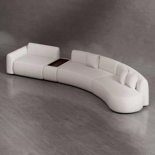 Modern white sofa with a built-in coffee table on a gray floor and background
