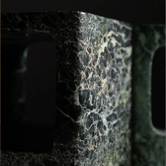 Close-up of a textured stone surface with a dark background