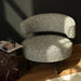 Modern chair with textured pattern in a room setting