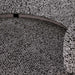 Close-up of textured gray carpet with patterned border