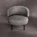 Modern chair with textured gray upholstery on a dark background