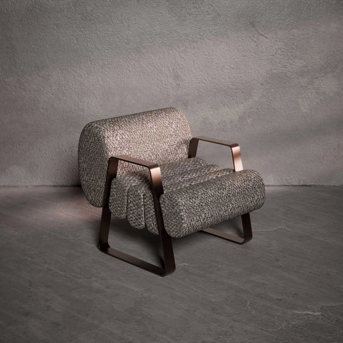 Gray textured armchair with bronze accents on a gray background