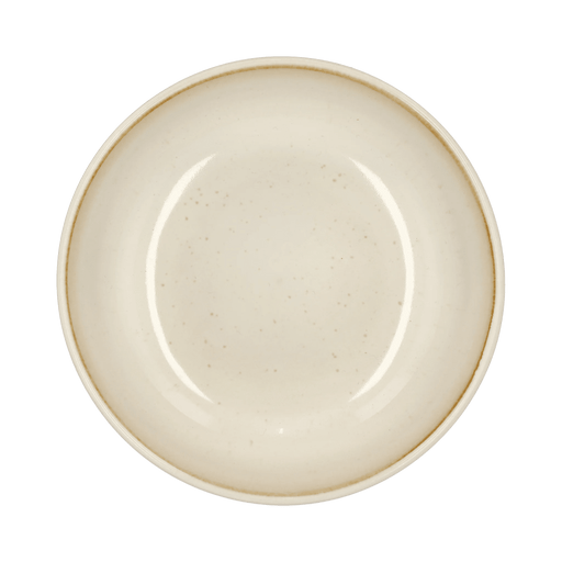 Beige ceramic plate on a green background
