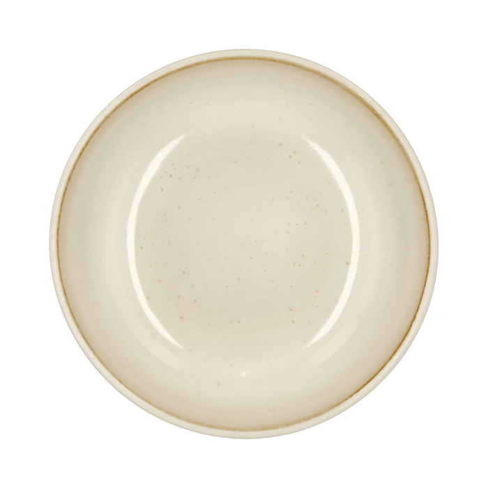 Beige ceramic plate on a green background