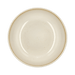 Beige ceramic plate on a green background