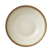 Round ceramic plate with a brown rim on a green background