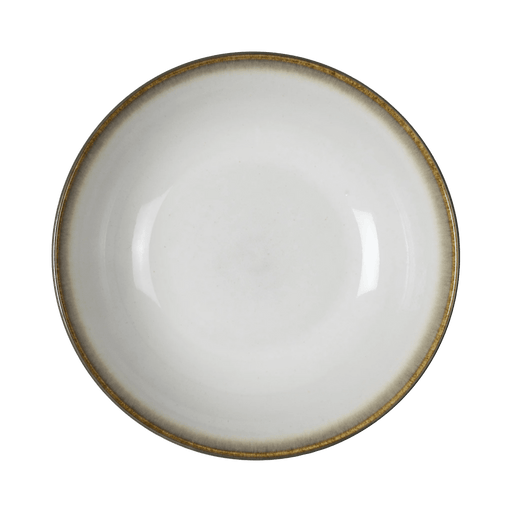 White ceramic bowl with a gold rim on a green background
