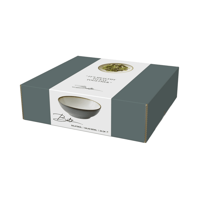 Box packaging of a ceramic bowl with branding on a green background