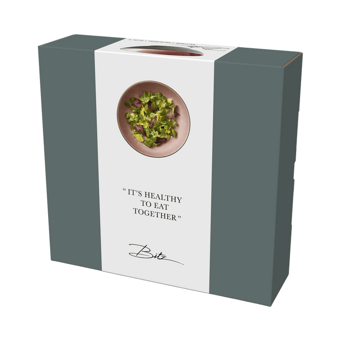 Product packaging with a green leafy image and text on a white background