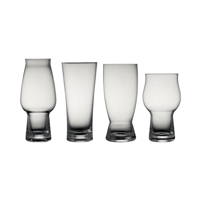 Four clear glass tumblers on a white background