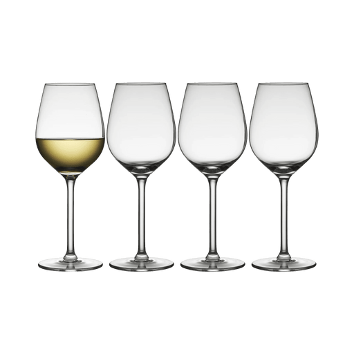 Four wine glasses with white wine on a white background