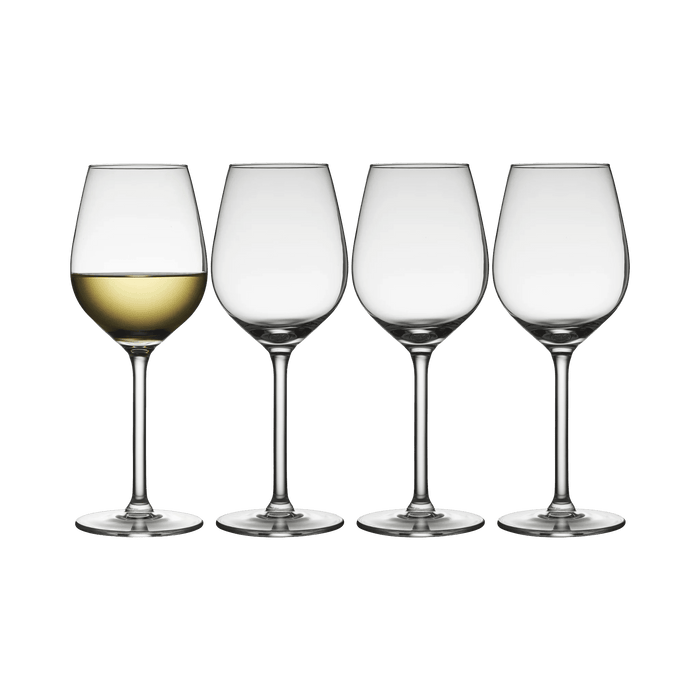 Four wine glasses with white wine on a white background