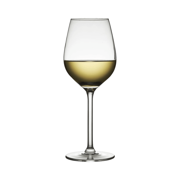 Clear wine glass with white wine on a white background