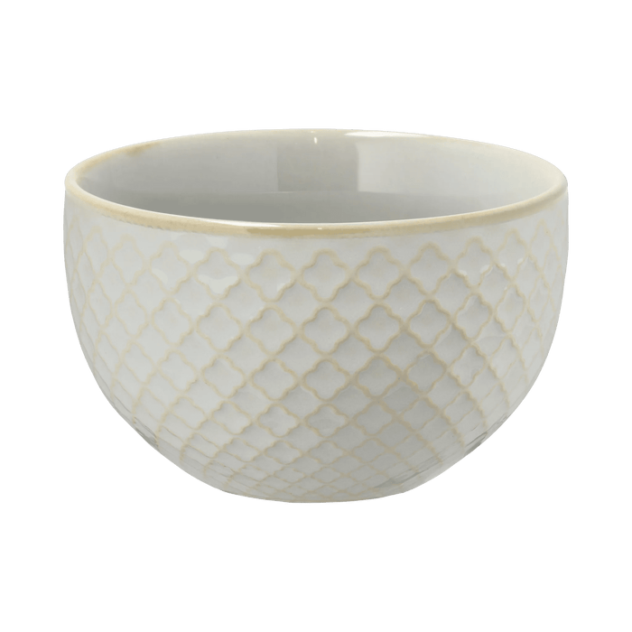 White ceramic bowl with lattice pattern on a green background