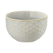 White ceramic bowl with honeycomb pattern on a green background