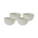 Set of four ceramic bowls with textured surface on a green background