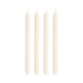 Four white candles on a green background