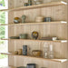 Wooden shelves with decorative items against a wooden wall