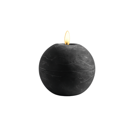 Black spherical candle with a lit wick on a white background
