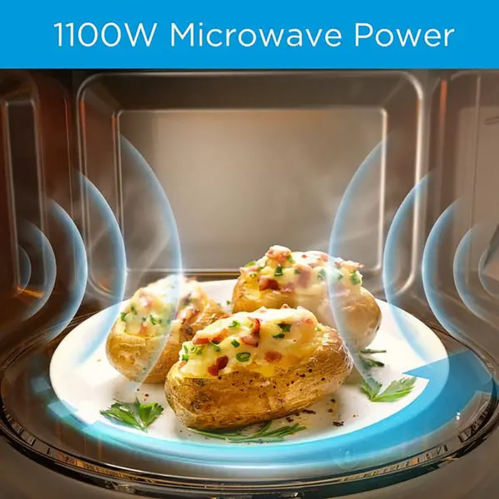 Baked potatoes with cheese and herbs inside a microwave oven with 1100W microwave power text.